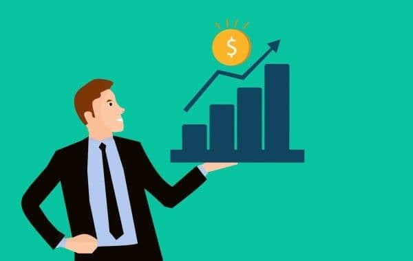 Ilustración de empresario sosteniendo una gráfica con índices positivos.